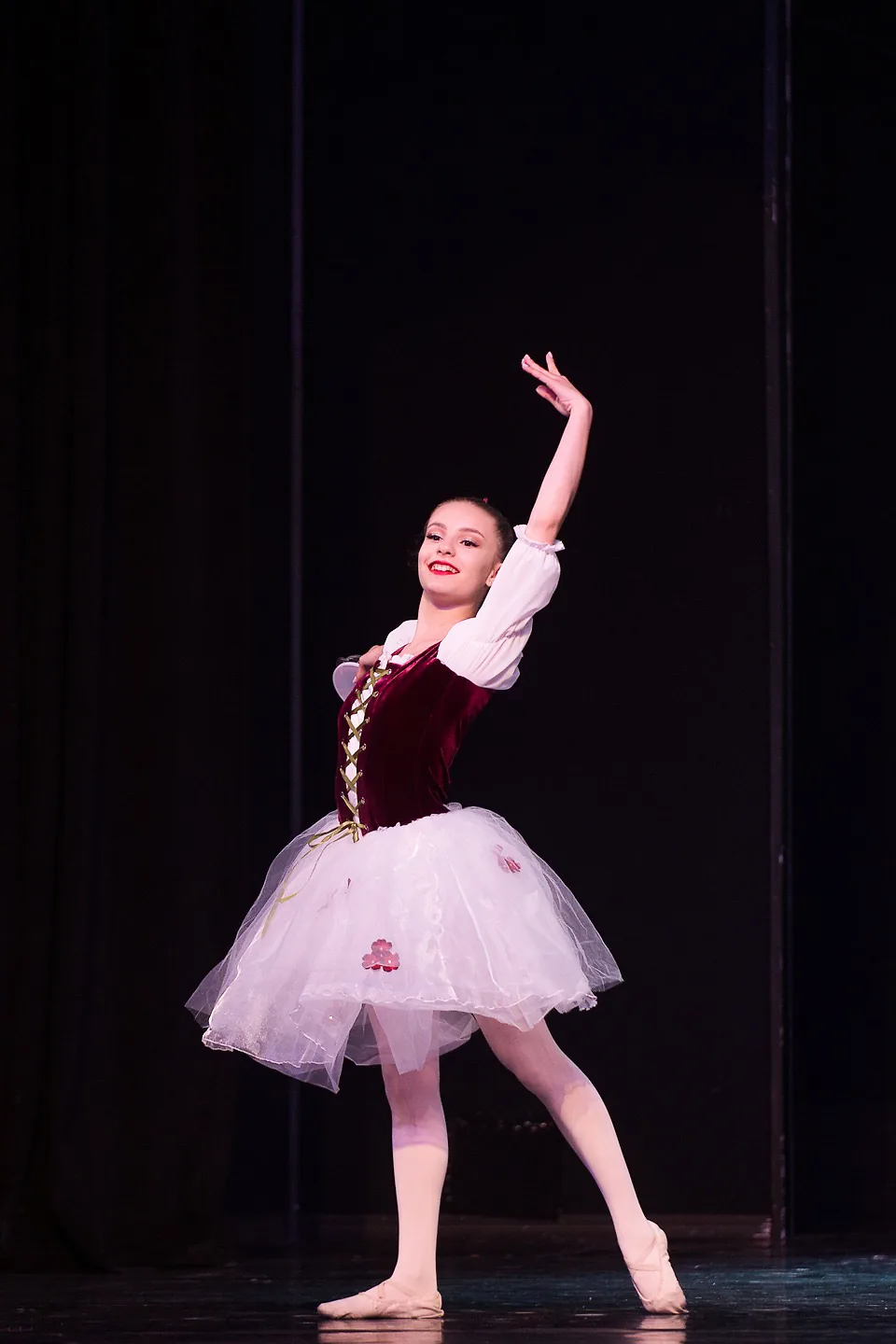 A ballet student performing on stage